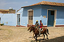 Horsemen Riding through Trinidad Cuba