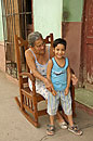 Lady in Rocking Chair with Grandson