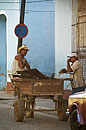 Man in Hat sitting on Cart Cuba