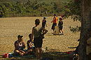 Mothers having a picnic Boys Play Baseball