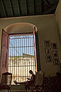 Portrait lady reading on the windowsill