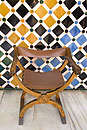 Single Chair against Tiled Wall