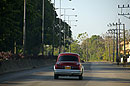 Red Car on the Airport Road