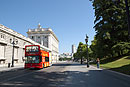 Red Tourist Bus Driving Past Palacio Real