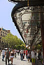 People Walking Past Ornate Building Madrid