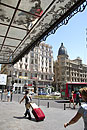 Tourist with Red Case Gran Via Madrid