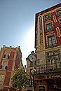 Madrid Street with sun glowing behind building