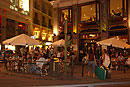 Tourists arriving at Night at Caf� Principe Madrid