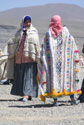 2 women in knitted robes