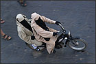 Moroccan's on a moped