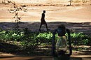 Man Walking in Dry River Bed