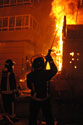 Firemen dowsing the Fallas burning