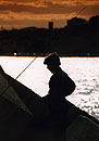 Boy fishing at Vila Port