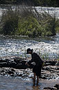 Woman paddling at Edge of Falls