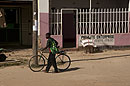 Boy Walking his Bike