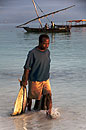 Fisherman Wading in with Catch
