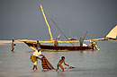 Woman & Child Wash Cloth in Sea