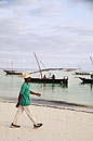 Man Walks Past Fishing Dhow