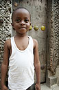 Boy in front of Stone Town Door