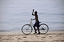 Boy with Bike Waving to Friends 