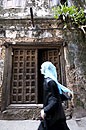Muslim Lady Passing Zanzibar Door